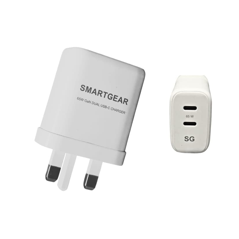SmartGear 65W GaN charger next to a MacBook Air — smaller and cheaper than Apple's charger